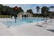 A refreshing community pool with lounge chairs and a splash area for summer fun at 604 Craftsman Ridge Trail Trl, Knightdale, NC 27545