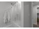 Shower featuring clear glass enclosure, a shower head, and white towel racks to the left at 604 Craftsman Ridge Trail Trl, Knightdale, NC 27545