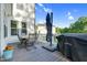 Outdoor deck area with patio furniture, grill, and lush green surroundings, ideal for entertaining at 6404 Fauvette Lane Ln, Holly Springs, NC 27540
