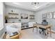 Well-lit office space with modern decor, open shelving, and a functional layout perfect for remote work or study at 6404 Fauvette Lane Ln, Holly Springs, NC 27540