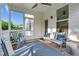 Relaxing screened porch with comfortable seating, wood flooring, and serene views of the neighborhood at 6404 Fauvette Lane Ln, Holly Springs, NC 27540