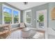 Sunroom featuring ample natural light, with access to outdoor deck, a relaxing space for leisure and activities at 6404 Fauvette Lane Ln, Holly Springs, NC 27540
