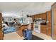 Open-concept kitchen with linoleum flooring, kitchen island, and adjacent living space at 70 Fieldside Dr, Louisburg, NC 27549