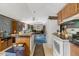 Open kitchen and living area with classic appliances and an island with seating at 70 Fieldside Dr, Louisburg, NC 27549