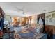Open living room with carpeting, ceiling fan, and a comfortable seating area at 70 Fieldside Dr, Louisburg, NC 27549