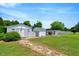 Exterior view of outbuildings on property with blue skies and green grass at 70 Fieldside Dr, Louisburg, NC 27549