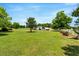 Expansive yard with well-manicured lawn and mature trees, perfect for outdoor activities at 70 Fieldside Dr, Louisburg, NC 27549
