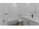 Bathroom features tiled shower, bronze hardware, and a vanity at 710 W North St # 102, Raleigh, NC 27603