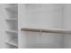 A well-organized closet with wood closet rods and built in shelving at 710 W North St # 102, Raleigh, NC 27603
