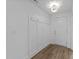Bright entryway with coat hooks, paneling, and a white door, offering a welcoming space at 710 W North St # 102, Raleigh, NC 27603