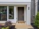 Charming front entrance featuring a stylish door, modern accents, and attractive landscaping at 710 W North St # 102, Raleigh, NC 27603