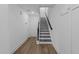 Bright hallway featuring a staircase and sleek flooring, creating a modern transition space at 710 W North St # 102, Raleigh, NC 27603