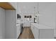 New kitchen design boasts white cabinets, marble countertops, and modern appliances, a chef's dream at 710 W North St # 102, Raleigh, NC 27603