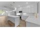 Bright kitchen features white cabinetry, marble countertops, and modern stainless steel appliances at 710 W North St # 102, Raleigh, NC 27603