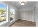 Well-lit home office featuring large windows, neutral walls, and stylish flooring at 710 W North St # 102, Raleigh, NC 27603