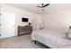 Comfortable bedroom with neutral carpet, ceiling fan, and a large dresser for storage at 72 Ina Rose Ln, Four Oaks, NC 27524