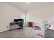 Bedroom features a desk, and play area under a sunlit window at 72 Ina Rose Ln, Four Oaks, NC 27524