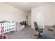 Bedroom includes a glider rocker, bassinet, and desk, providing space and functionality at 72 Ina Rose Ln, Four Oaks, NC 27524