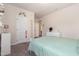 Bedroom featuring a decorative wall art, a white dresser, and soft green linens at 72 Ina Rose Ln, Four Oaks, NC 27524