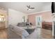 Comfortable living room with a gray sofa, piano and access to the backyard at 72 Ina Rose Ln, Four Oaks, NC 27524