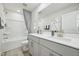 Bright bathroom features double sinks, a large mirror, and a shower-tub combo for convenience at 740 Deschutes Dr, Garner, NC 27529