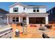 New construction of a two-story home with a large two-car garage in the process of being completed at 740 Deschutes Dr, Garner, NC 27529