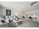 Upstairs living area features a gray sofa, stylish desks, and ample space for relaxing or working at 740 Deschutes Dr, Garner, NC 27529