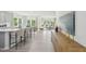 Bright, open-concept living space with hardwood floors, a modern kitchen island, and scenic views at 740 Deschutes Dr, Garner, NC 27529