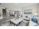 Spacious living room showcasing a modern kitchen, staircase, and an elegant living space at 740 Deschutes Dr, Garner, NC 27529