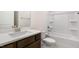 Bathroom features a white sink with a quartz countertop and a full bathtub and shower combination at 79 Bronco Pace Dr, Clayton, NC 27520