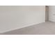 Simple bedroom with neutral carpet, an electrical outlet, and a closet at 79 Bronco Pace Dr, Clayton, NC 27520