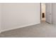 Bedroom featuring neutral carpet and access to an ensuite bathroom at 79 Bronco Pace Dr, Clayton, NC 27520