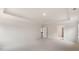 Spacious bedroom has neutral carpeting, paint, a tray ceiling and doors to other rooms at 79 Bronco Pace Dr, Clayton, NC 27520