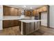 Elegant kitchen equipped with a large kitchen island, ample countertop space, and modern appliances at 79 Bronco Pace Dr, Clayton, NC 27520