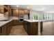 Well-equipped kitchen with stainless steel appliances, white countertops, and a kitchen island at 79 Bronco Pace Dr, Clayton, NC 27520