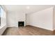 Comfortable living room featuring hardwood floors and a cozy fireplace for relaxing evenings at 79 Bronco Pace Dr, Clayton, NC 27520