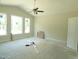 Unfinished bedroom with multiple windows offering ample natural light at 802 Shade Tree Rd, Benson, NC 27504