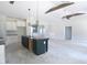 Open floor plan showcases an unfinished kitchen, large island, and pendant lighting at 802 Shade Tree Rd, Benson, NC 27504