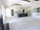 Open concept with fireplace, kitchen island, and high ceilings create a great flow throughout the home at 802 Shade Tree Rd, Benson, NC 27504