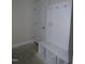 A new mudroom area with storage bench, cubbies, hooks, and a door offers space to stay organized at 802 Shade Tree Rd, Benson, NC 27504