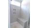 New shower showcases decorative tile work, built-in seat, convenient niche, and window for natural light at 802 Shade Tree Rd, Benson, NC 27504