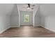 Bright, airy bonus room with hardwood floors, ceiling fan and window view at 8304 Southmoor Hill Trl, Wake Forest, NC 27587