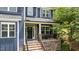 Charming front porch with brick accents, perfect for relaxing and enjoying neighborhood views at 8304 Southmoor Hill Trl, Wake Forest, NC 27587