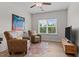 Cozy living room with hardwood floors, natural light and comfortable seating at 8304 Southmoor Hill Trl, Wake Forest, NC 27587