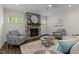 Inviting living room featuring a stone fireplace, patterned armchairs, and a stylish coffee table at 8304 Southmoor Hill Trl, Wake Forest, NC 27587
