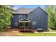 Back exterior view featuring a screened porch and grill, ideal for outdoor gatherings and relaxation at 8304 Southmoor Hill Trl, Wake Forest, NC 27587