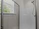 Clean shower stall with glass door and window allowing natural light at 8304 Southmoor Hill Trl, Wake Forest, NC 27587