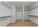 Spacious walk-in closet offers ample storage with multiple rods and hardwood floors at 8304 Southmoor Hill Trl, Wake Forest, NC 27587