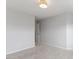 Clean and neutral bedroom with carpet flooring, doorway visible to other parts of the house at 9327 Falkwood Rd, Raleigh, NC 27617