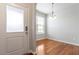Entryway view of dining area with hardwood floors and chandelier lighting at 9327 Falkwood Rd, Raleigh, NC 27617